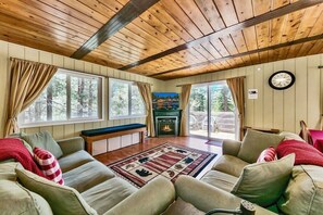 The cozy living room is an ideal space for relaxing after a long day of exploring South Tahoe. This room is equipped with a gas fireplace, comfy couches, and a large flat screen TV.