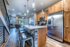 Kitchen - Beautiful kitchen with stainless steel appliances, granite counters, and hardwood flooring.