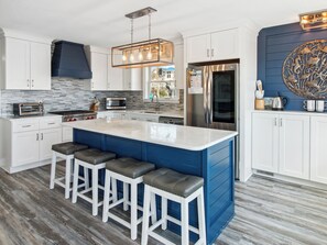 Whip up something delicious in the Gourmet Kitchen with luxurious Wolf appliances and a Convection Steam Oven that is perfect for preparing fresh, local Outer Banks seafood.