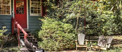 Rock patio entrance is a beautiful spot for coffee or wine