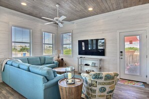 The large, elegant windows allow the living room to be filled with lots of natural lighting.