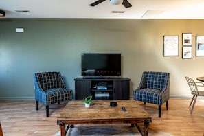 Welcome to our little slice of heaven! Our living room is the epitome of comfort and style. The plush couch is perfect for lounging, the cozy chair is ideal for those moments of solitude, and the sleek table adds a touch of elegance. Every detail in this space has been carefully curated to create a cozy and inviting ambiance.
