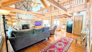 Great room with large sectional and a recliner, TV with Roku, and fireplace