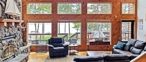 Comfortable living room with ample windows and scenery of the Lake.