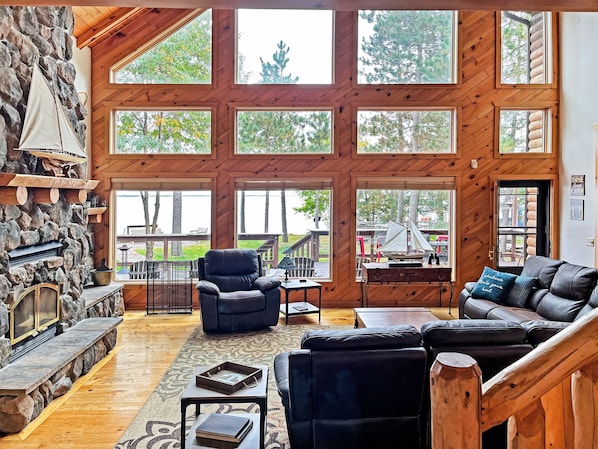 Comfortable living room with ample windows and scenery of the Lake.