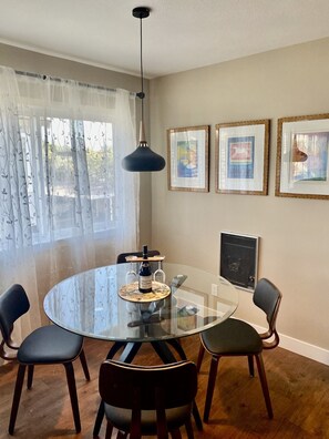 Dining area with glass table. 