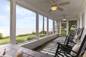 Relax on the screened back porch and enjoy the stunning river views.