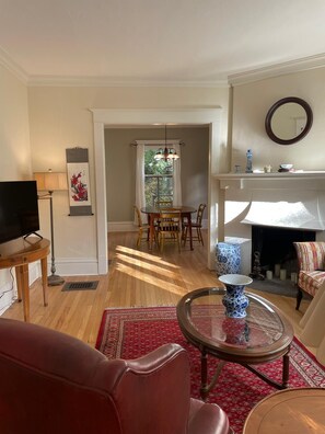 View of living area and dining room from sunroom.