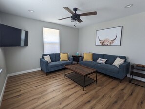 Living room features an HDTV with Roku for connecting your streaming accounts.