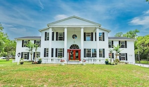 over 10 acres, 6 bedrooms, 5 full baths, game room, pool and tennis