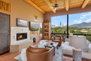 Family room with Cozy fireplace and 65" smart tv