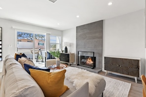 Living room with sliding door to private back patio