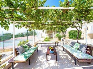 Plant, Shade, Outdoor Furniture, Botany, Outdoor Bench, Tree, Urban Design, Building, Real Estate, Leisure
