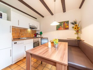 Furniture, Cabinetry, Countertop, Wood, Orange, Interior Design, Kitchen, Kitchen Stove, Flooring, Drawer