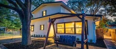Enjoy your front yard swing under the shade of a large oak!
