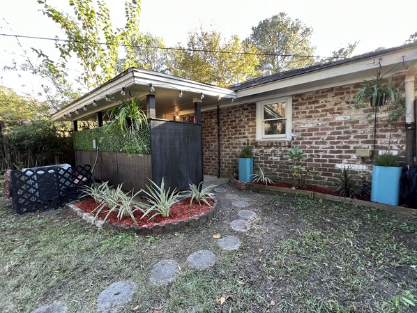 Front patio/ main entrance from Private parking driveway.