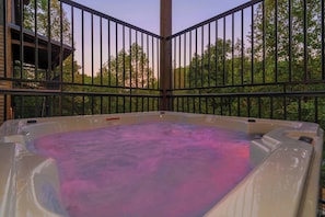 Outdoor hot tub on same level as the pool.
