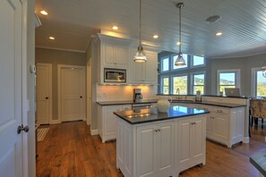 Gourmet kitchen with views into family room and breakfast dining area