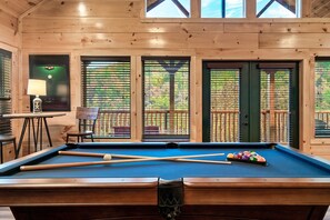 In the game room, enjoy a game of pool on our 8 foot table.