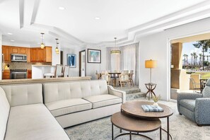Spacious villa with a dining table and extra seating at the bar top.