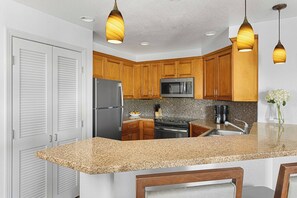 Full kitchen with Stainless Steel appliances.