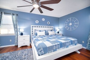 Cozy and serene bedroom featuring calming blue tones and modern décor, perfect for a restful night's sleep!