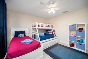 Bright and playful kids' room featuring cozy bunk beds and a vibrant color scheme, perfect for a fun family stay!