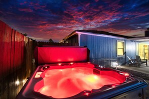 Indulge in a relaxing soak in this inviting hot tub, experiencing tranquility in style!