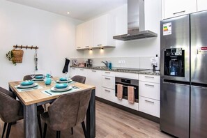 Dining table with open kitchen which is fully equipped (including dishwasher)