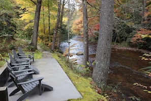 Patio by the river, steps from the house