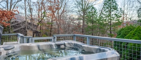 Enjoy the hot tub overlooking beautiful nature