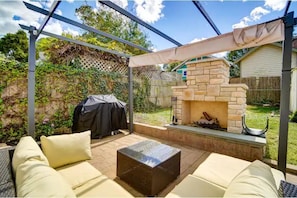 Cozy fire pit, outdoor seating and grill