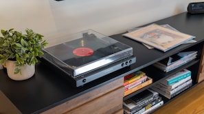 Record player and albums play through the surround sound system. 