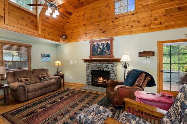 Log cabin tastefully decorated with gas fireplace and lots of seating.