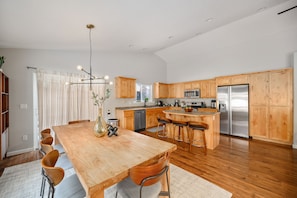 Dining room opens to the spacious kitchen with kitchen island.