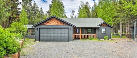 Large driveway comfortably fits four cars. One-level home