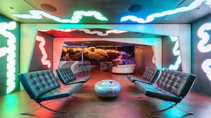 Unique color tiles light up the hallway seating leading to the bar & lounge