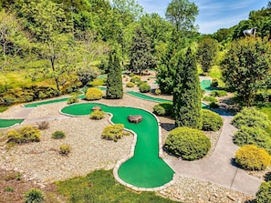 Bear Creek Crossing resort has a 9 hole mini golf course. Putters and balls in cabin