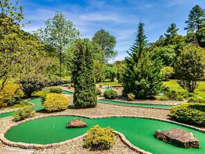 Bear Creek Crossing resort has a 9 hole mini golf course. Putters and balls in cabin