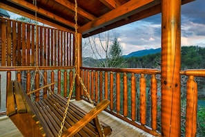 Enjoy views of Bluff Mountain from the porch swing on the back deck.