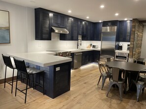 Kitchen/dining area with coffee bar (View from living area)
