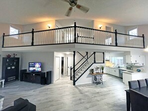 This beautifully designed space offers a blend of modern comforts and rustic charm. With a cozy seating area, sleek kitchen, and a stunning loft, it's perfect for families and groups.