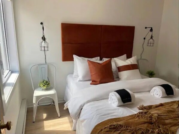 Main floor master bedroom with queen bed