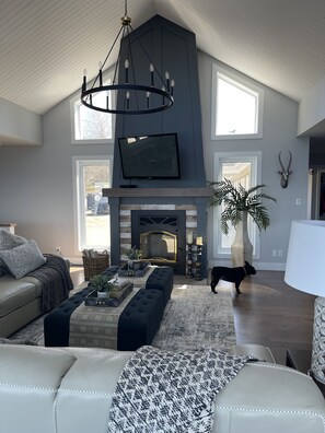 Beautiful wood fireplace in our main living area 