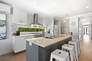 Large fully equipped kitchen and breakfast bar with everything you need