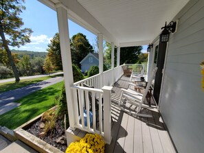 Enjoy the views of beautiful rolling hills from the large front porch, partially covered.