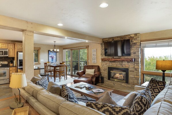 Yampa View 101 - a SkyRun Steamboat Property - Welcome to Yampa View 101, your Steamboat Springs sanctuary! - Photo taken from entryway showing living room, dining area, and kitchen.