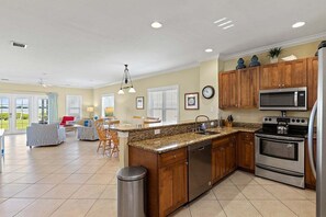 A seamless blend of living, dining, and kitchen spaces, perfect for creating unforgettable memories together.