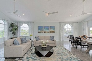 Unwind in the spacious living room, seamlessly connected to a stylish 6-seater dining area for gatherings and feasts.