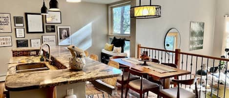 Dining table for 6, Open floor plan with floor to ceiling windows in the living area!